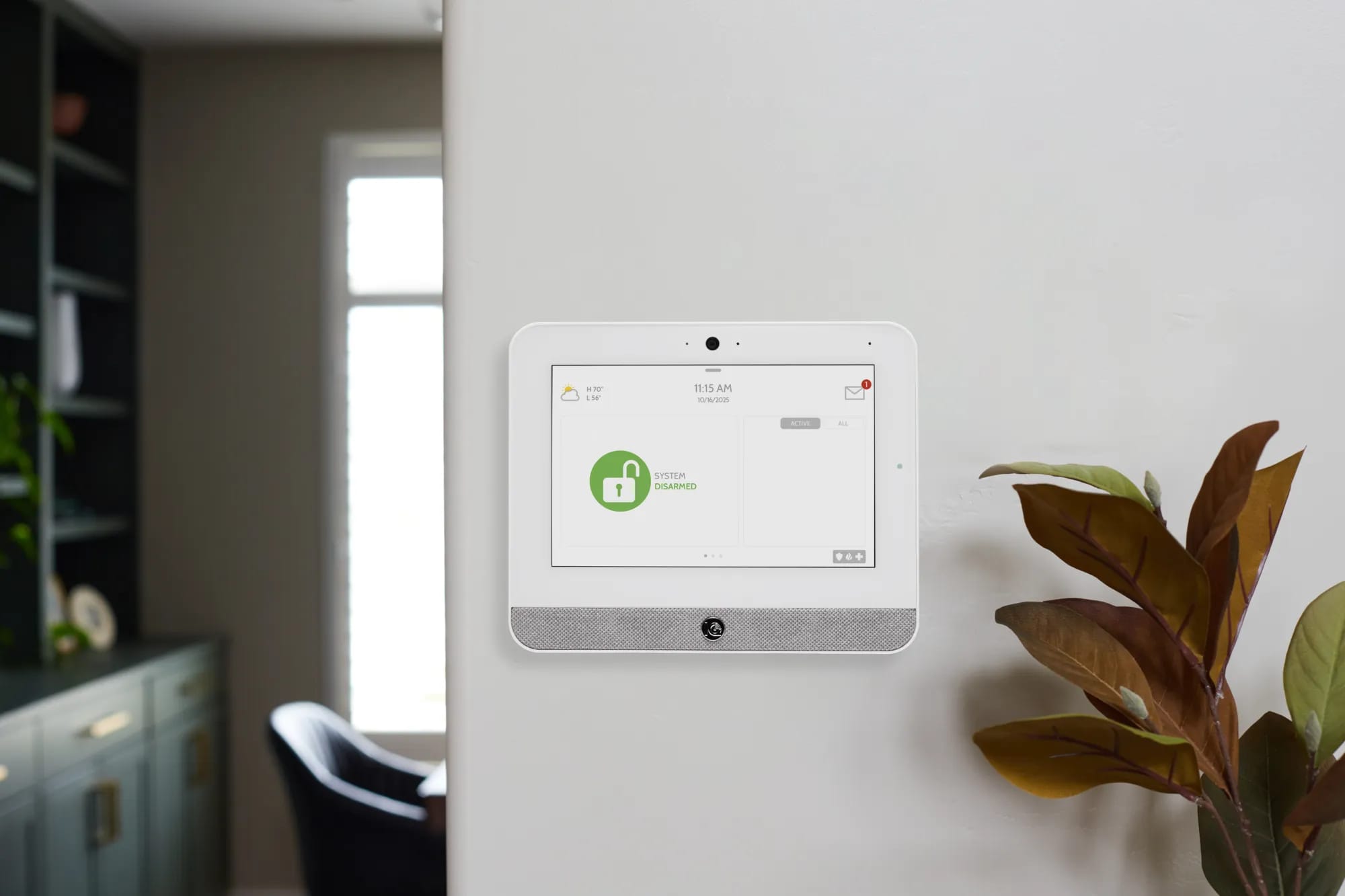 Qolsys IQ Panel 5 smart security panel mounted on a wall in a modern home