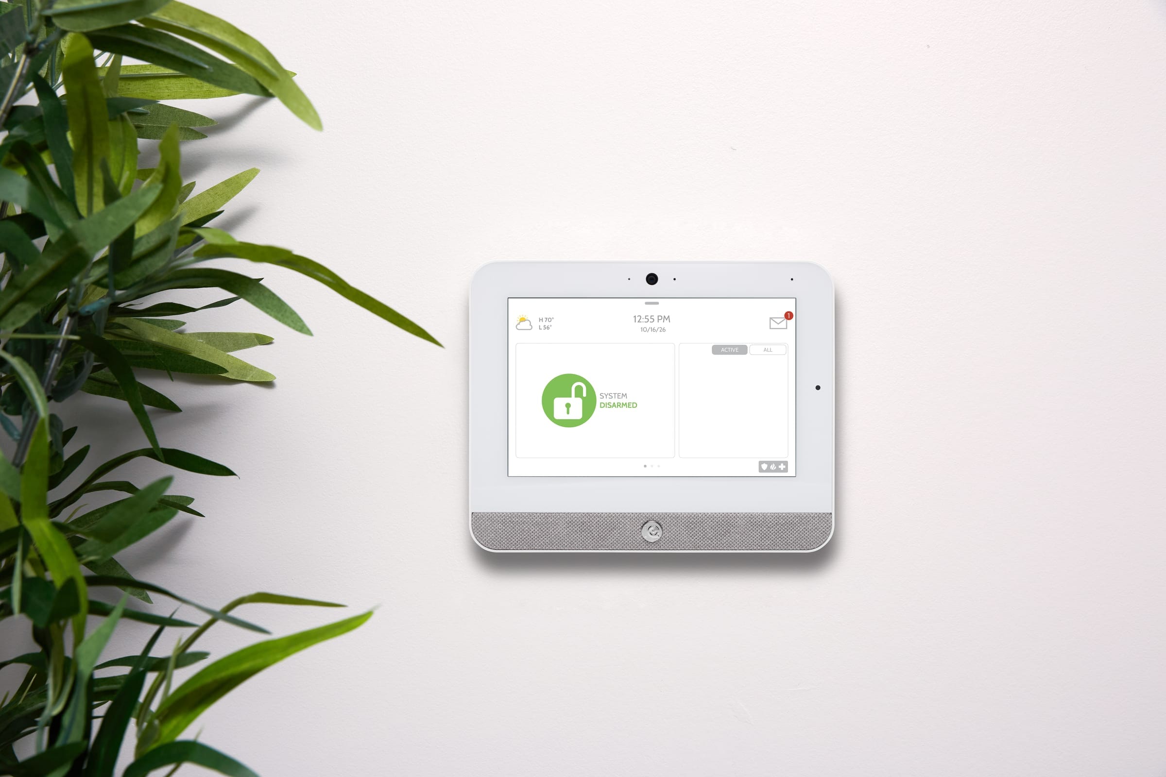 IQ Panel 5 smart-home security panel mounted in a bright modern home