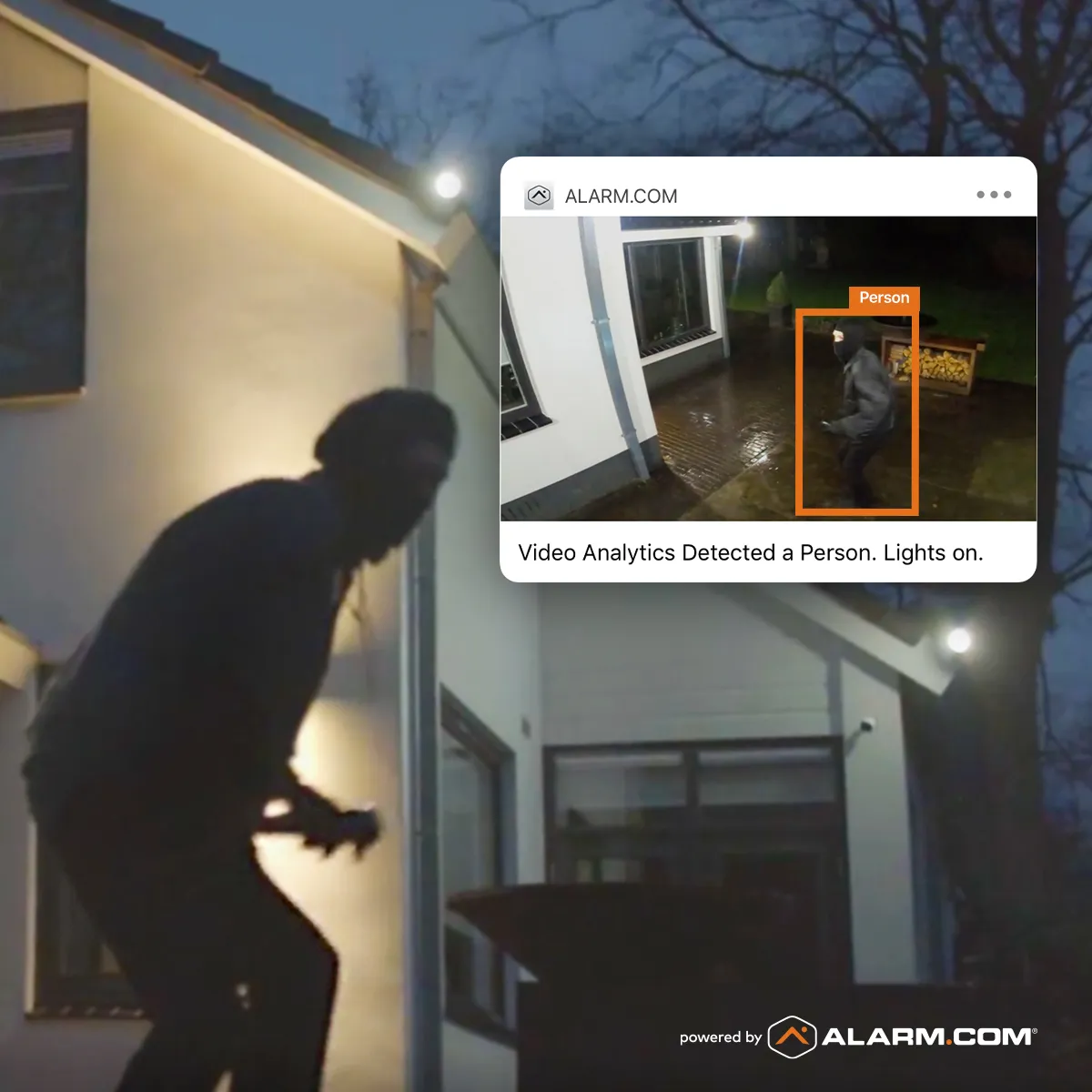 Alarm.com video analytics detecting a hooded intruder approaching a home at night and triggering a real-time person-detected alert